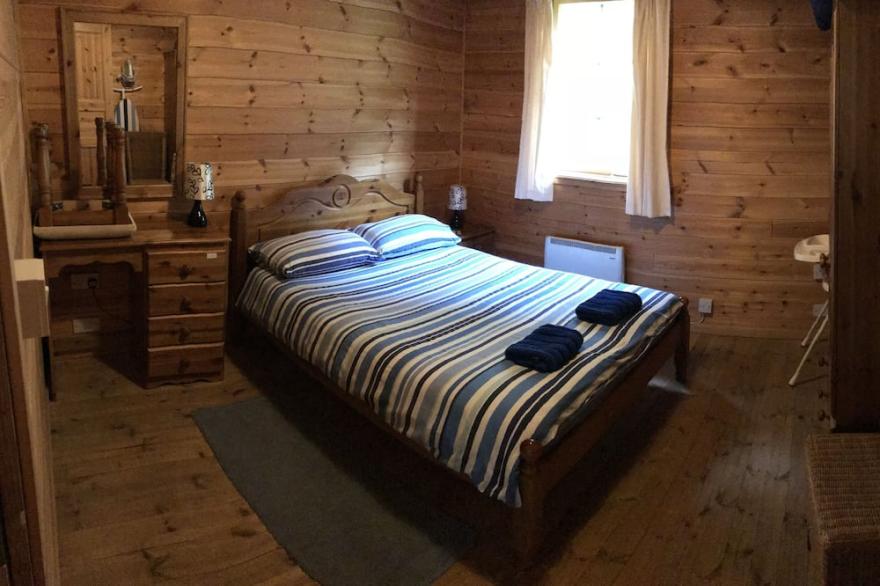 Finnish Holiday Lodges, set in wooded hillside, with mountain and stream views