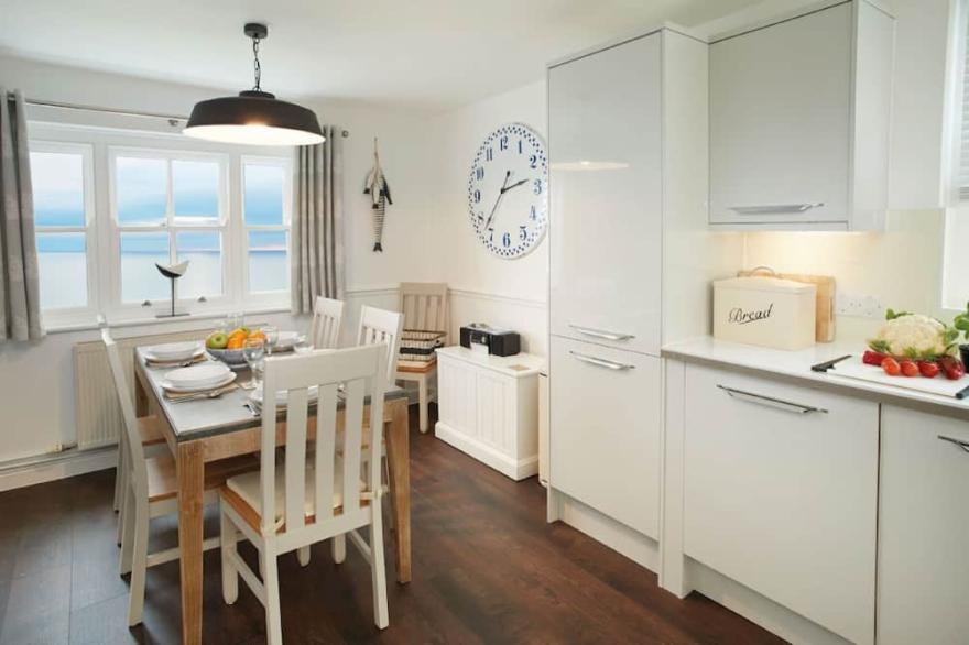 This attractive cottage on the Whitby Lighthouse site has a raised deck giving wonderful views.