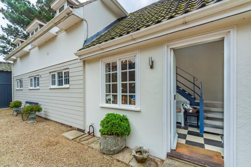 A sophisticated, contemporary ground floor apartment overlooking unspoilt views.