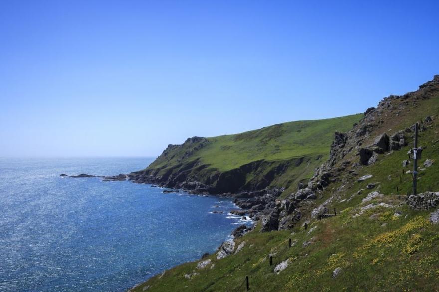 This detached cottage for six guests is perched on the cliff edge it enjoys views across Start Bay.