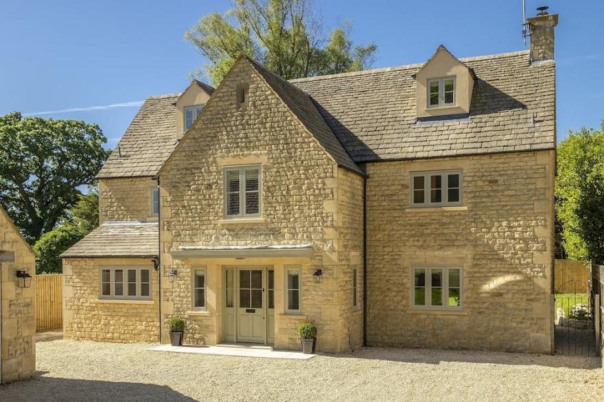 Set back from the road at the end of a private gated gravel driveway, this lovingly restored, spacio