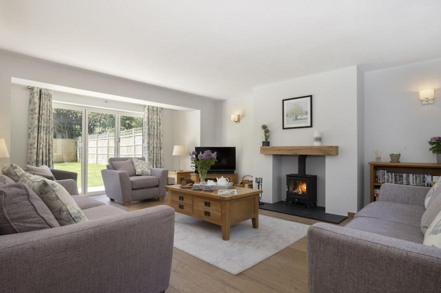 Set back from the road at the end of a private gated gravel driveway, this lovingly restored, spacio