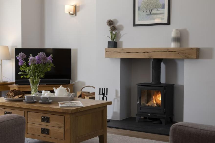 Set back from the road at the end of a private gated gravel driveway, this lovingly restored, spacio