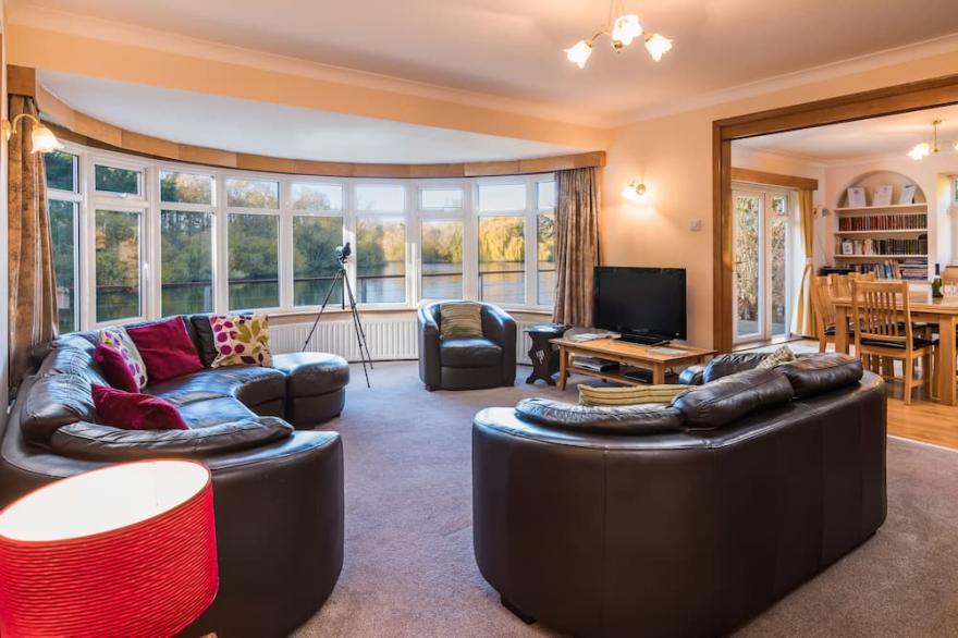 Luxury Lakeside Home In extensive grounds with boats, canoes and tennis court.