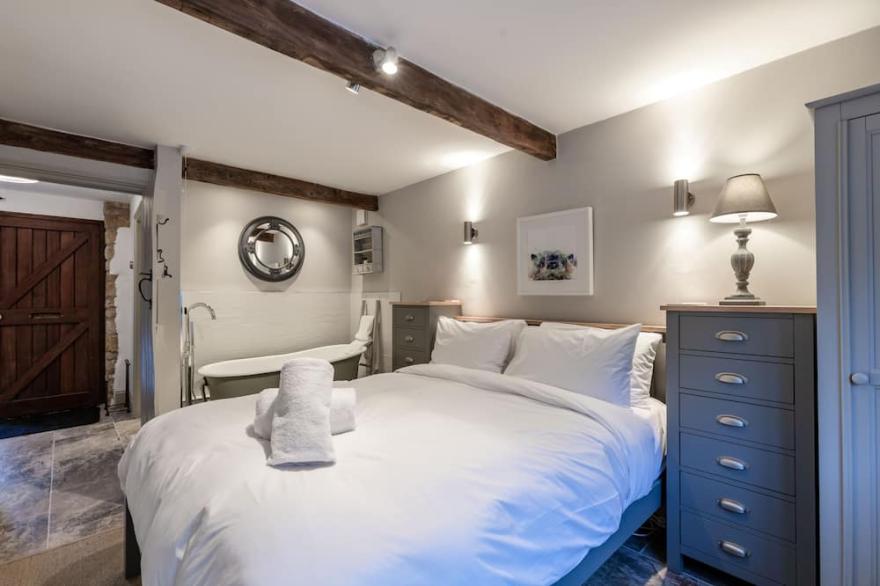 Stunning open plan 2 storey barn conversion with spiral staircase.