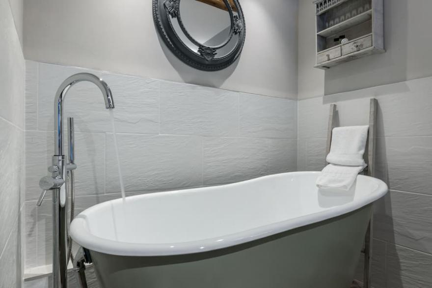 Stunning open plan 2 storey barn conversion with spiral staircase.