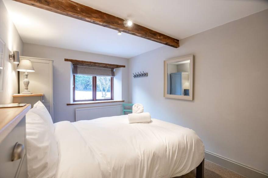 Stunning open plan 2 storey barn conversion with spiral staircase.