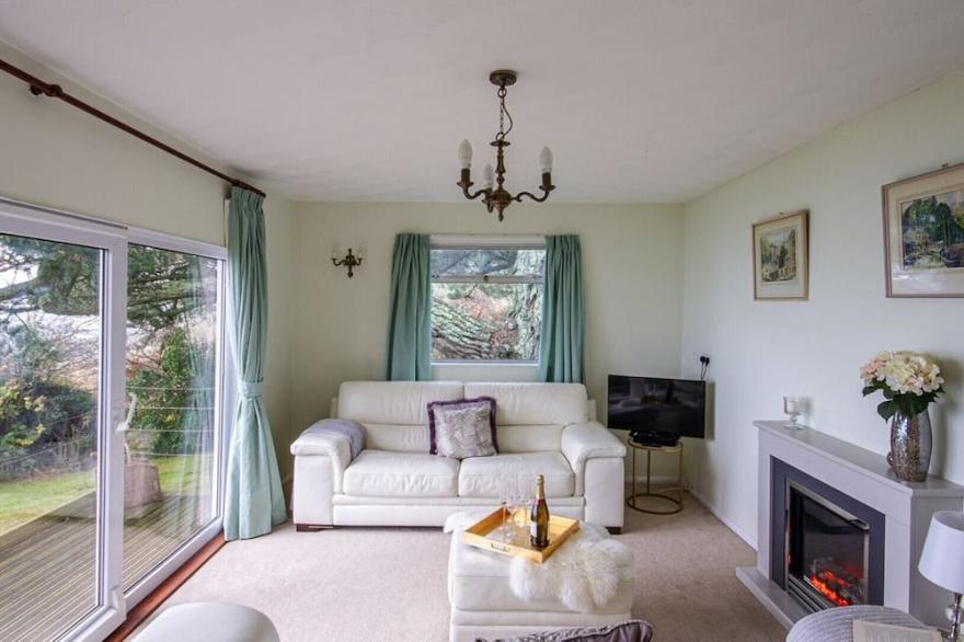 Windwhistle, an older style detached bungalow with superb views along the coast