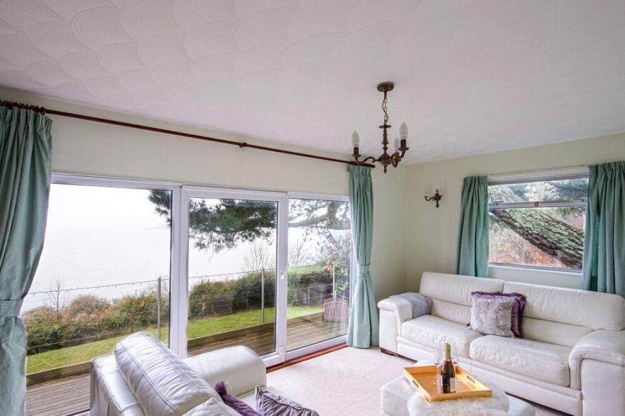 Windwhistle, an older style detached bungalow with superb views along the coast