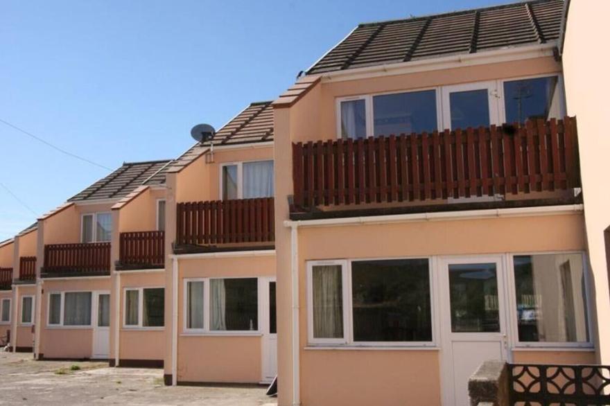 Blue Waters, a beautiful mid terrace holiday villa ideal for family beach trips