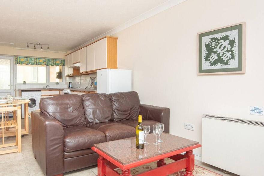 Blue Waters, a beautiful mid terrace holiday villa ideal for family beach trips