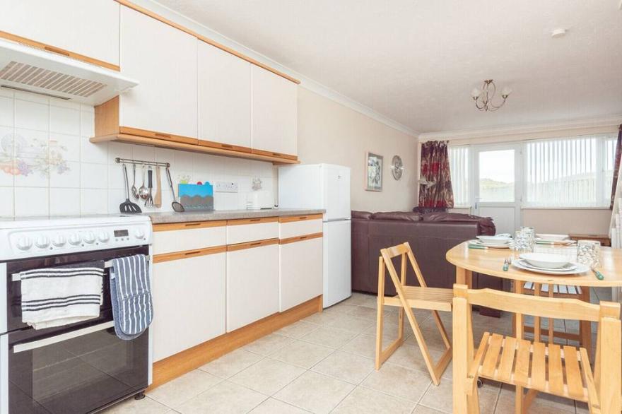 Blue Waters, a beautiful mid terrace holiday villa ideal for family beach trips