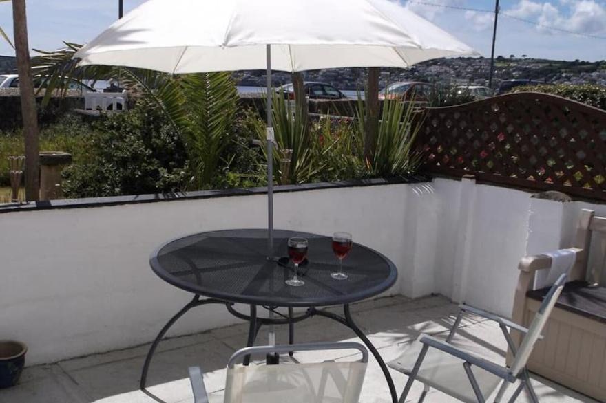 Seaspray, a mid terrace cottage situated in the attractive seaside town of Penzance