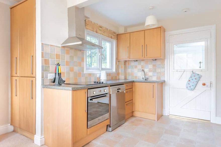 The Moorings, a spacious double glazed house in an elevated position and just across from Fowey