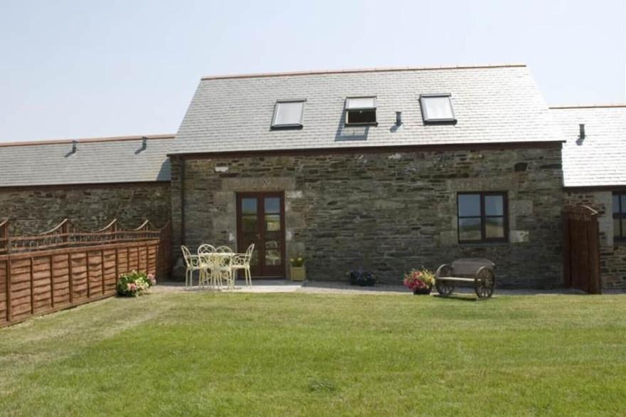 Skylark, a double glazed converted barn with far reaching views over St Ives and with beaches nearby