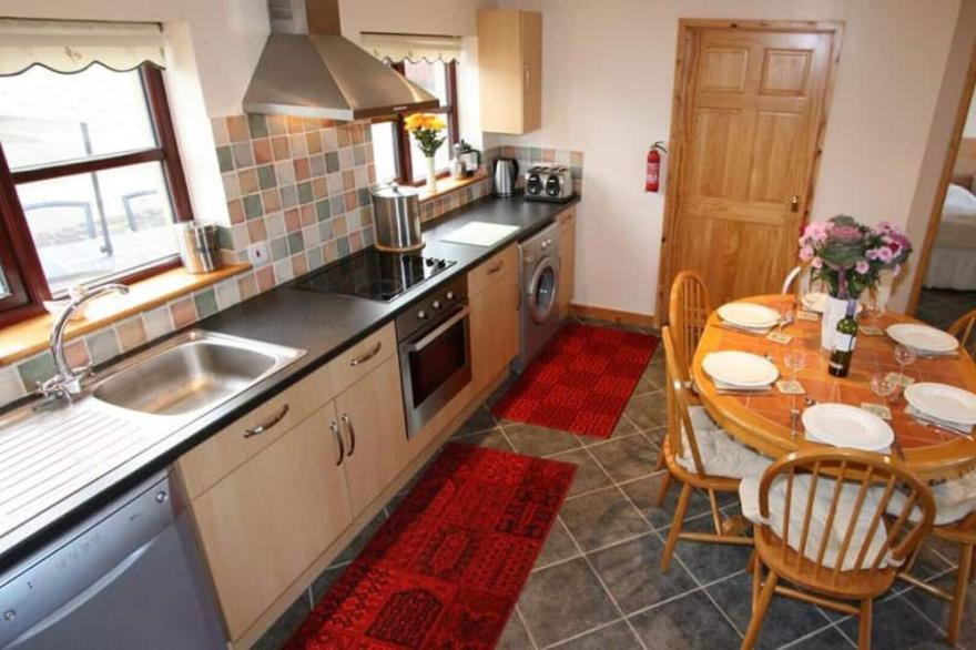 Skylark, a double glazed converted barn with far reaching views over St Ives and with beaches nearby