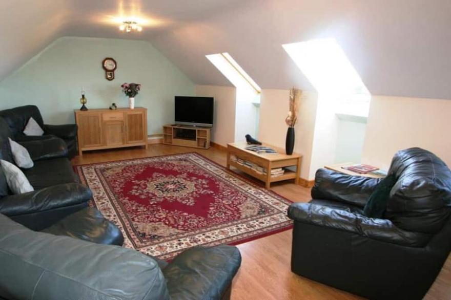 Skylark, a double glazed converted barn with far reaching views over St Ives and with beaches nearby