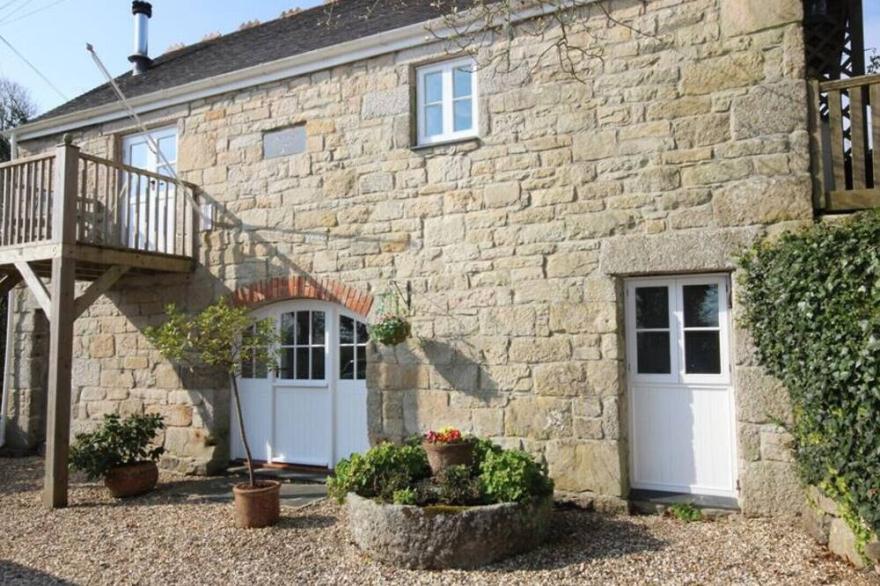 Penberthy Barn is a detached and spacious property near Carbis Bay and St Ives with a private hot tub