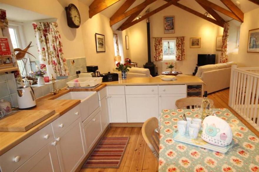 Penberthy Barn is a detached and spacious property near Carbis Bay and St Ives with a private hot tub