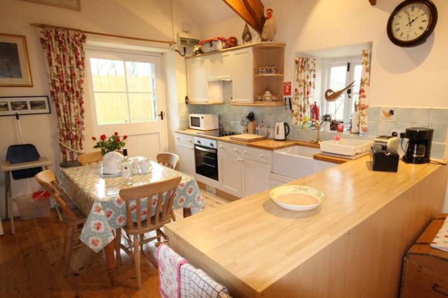 Penberthy Barn is a detached and spacious property near Carbis Bay and St Ives with a private hot tub
