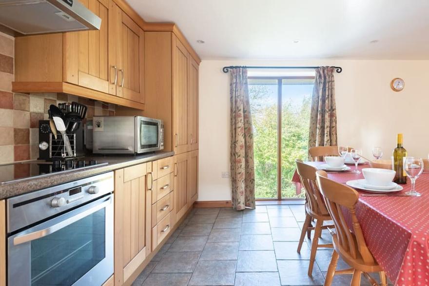 Hay Barn is a spacious stone barn conversion located on a working farm with beautiful countryside views