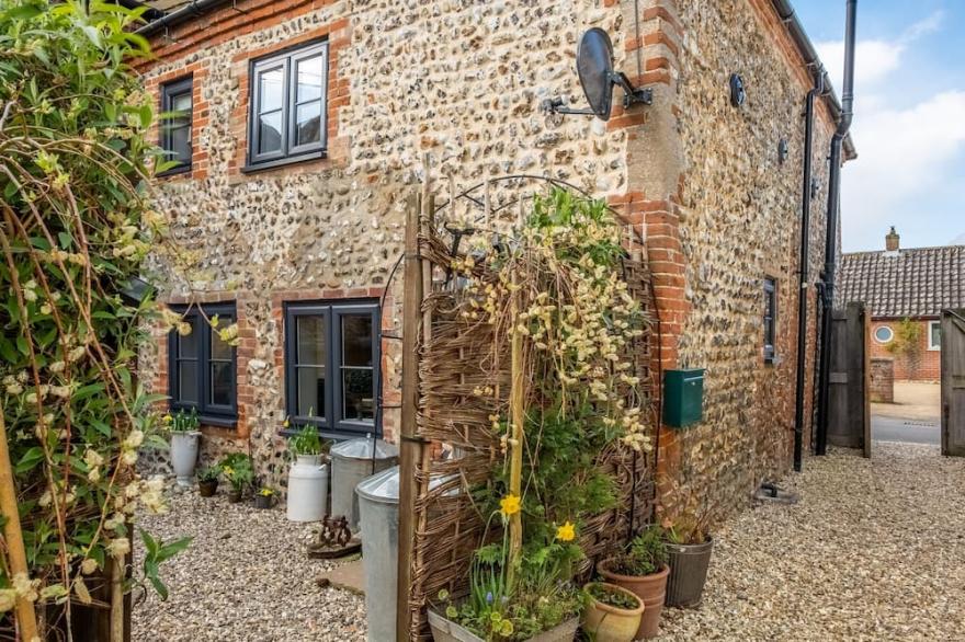 An absolutely gorgeous little cottage tucked quietly away In a peaceful backwater in this charming N