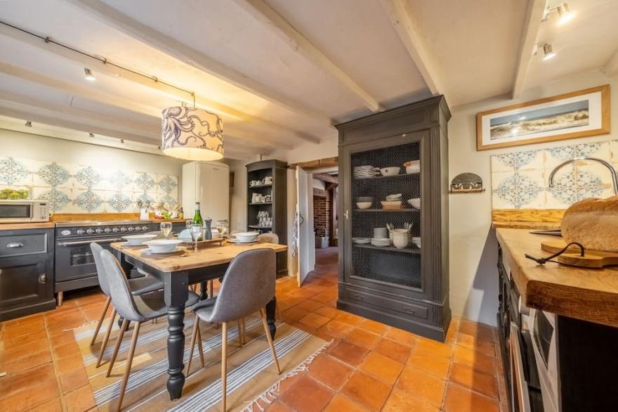 An absolutely gorgeous little cottage tucked quietly away In a peaceful backwater in this charming N