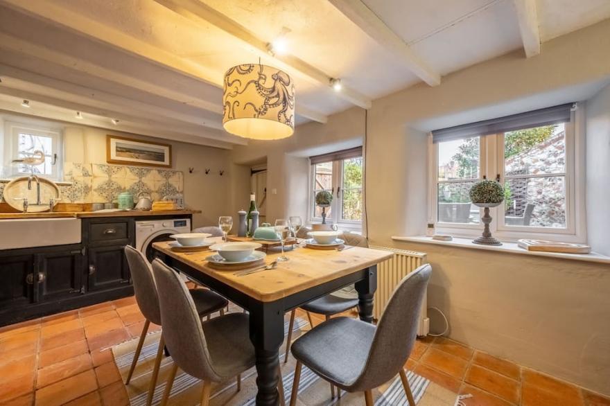 An absolutely gorgeous little cottage tucked quietly away In a peaceful backwater in this charming N