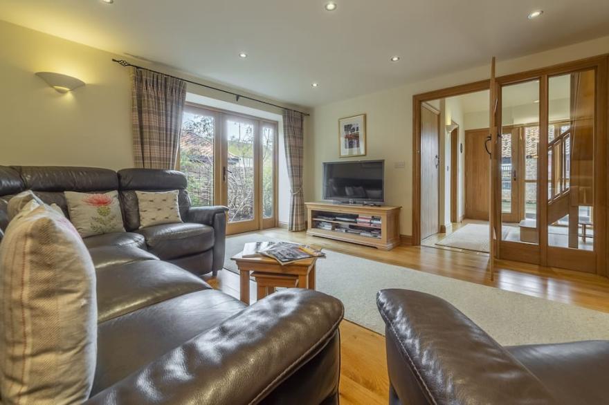 Sitting amongst farmland, this barn offers a peaceful luxury rural retreat.