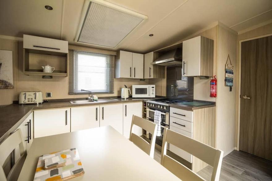 Modern 6 berth caravan with decking at Cherry Tree Park in Norfolk ref 70324C