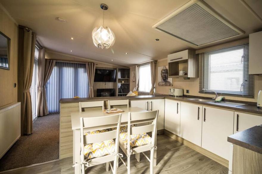 Modern 6 berth caravan with decking at Cherry Tree Park in Norfolk ref 70324C