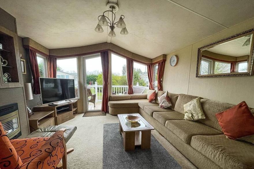 Lovely caravan with decking on a great holiday park ref 10002B