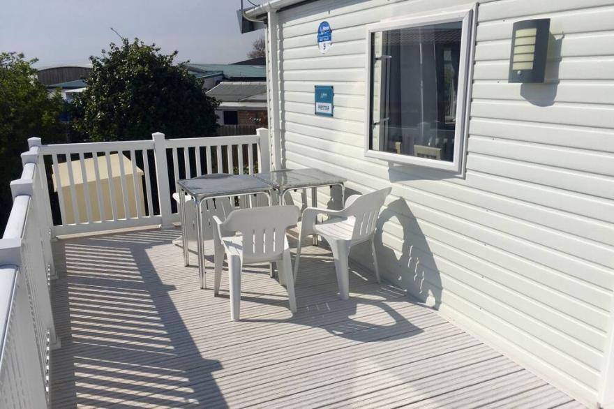 Modern 2 bedroom caravan.  Disabled friendly with wetroom & fab sun deck.