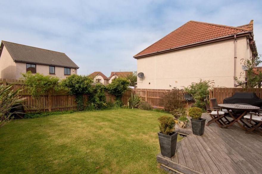 A fabulous 4-bedroom detached holiday home, with an attractive garden and private parking.