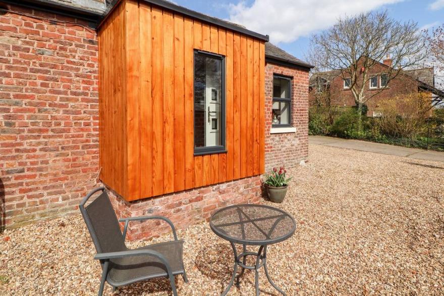 THE FLAT, pet friendly, character holiday cottage in Burgh By Sands