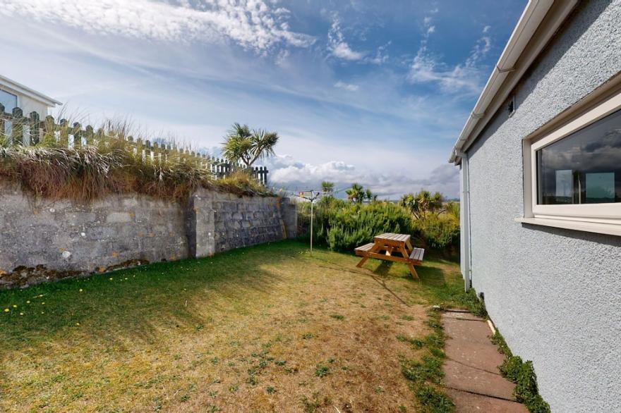 Beach front location with a sunny enclosed garden, three bedrooms and views of St Ives