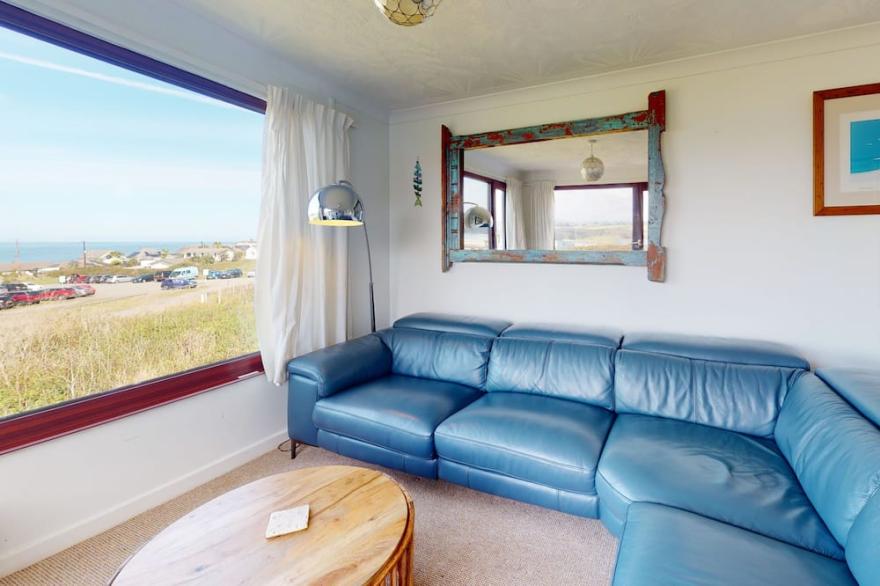 Beach front location with a sunny enclosed garden, three bedrooms and views of St Ives