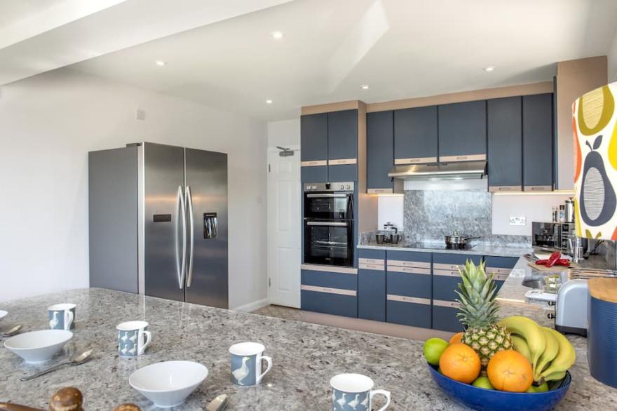 This large, comfortable six-bedroom house with a Sea view, is just moments from the beach and is the