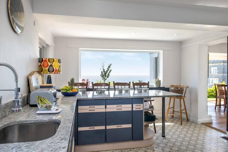 This large, comfortable six-bedroom house with a Sea view, is just moments from the beach and is the