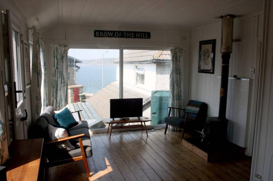 Delightful wooden cottage in the heart of Sennen Cove with ocean views