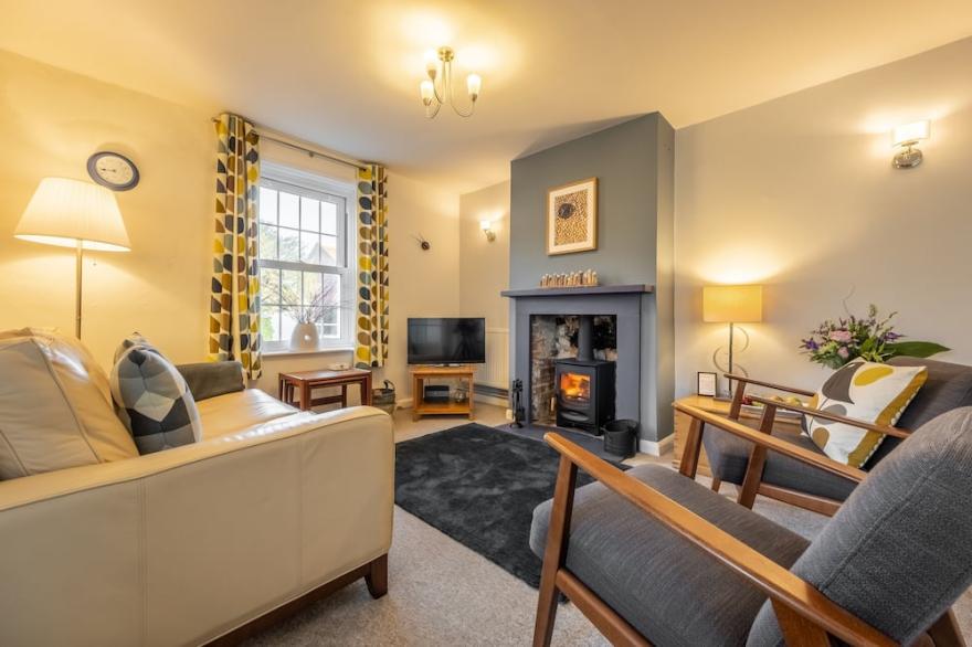 Pretty white-washed three bedroom cottage with distant marsh views