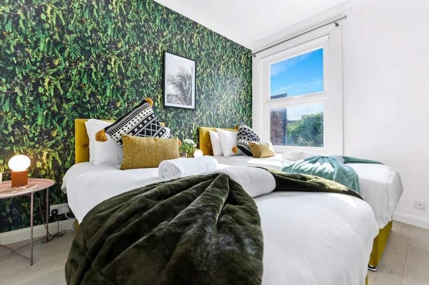Earth Tones and Greenery: 4BR Flat Sleeps 8