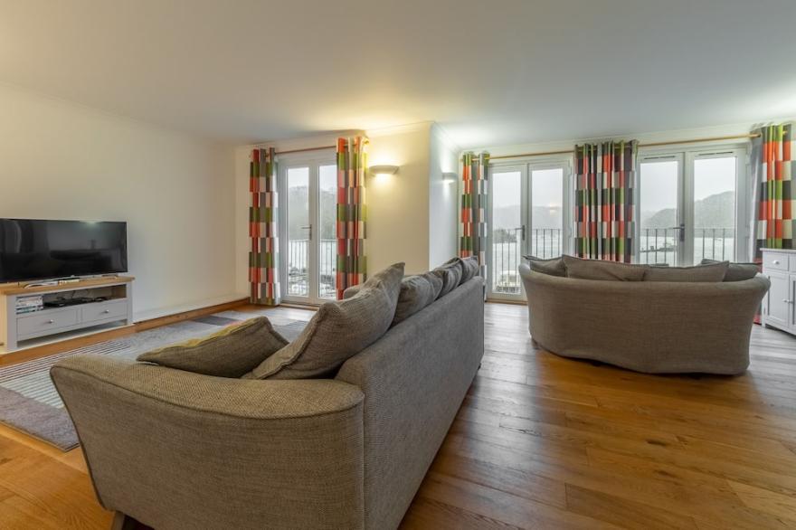 This holiday home is situated right on the water’s edge within the Malpas Marina