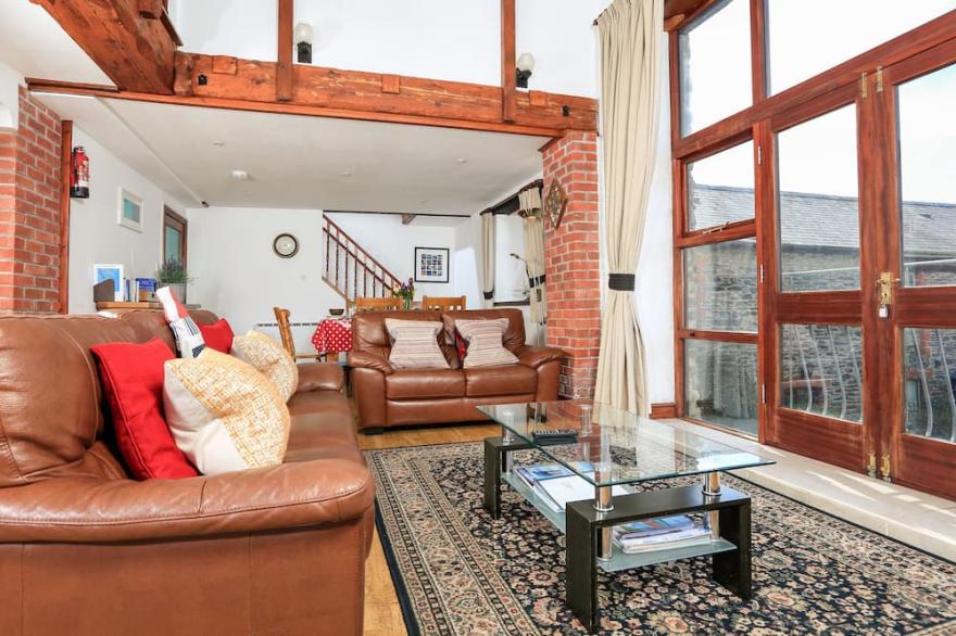 THE GRANARY (MALBOROUGH), pet friendly, with a garden in Malborough
