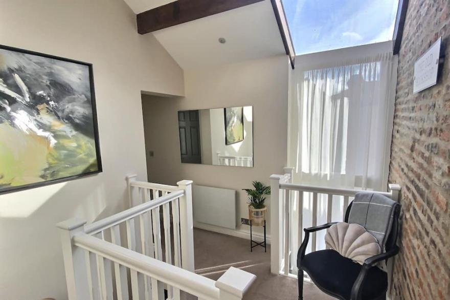 The Mitchell, Two bedroom townhouse with outside seating and free parking