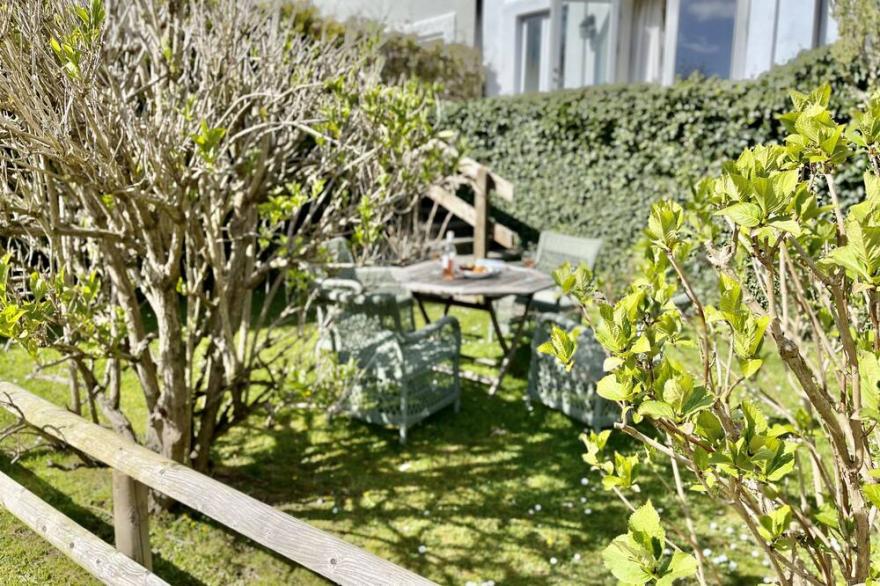 South-facing cottage with gardens and parking