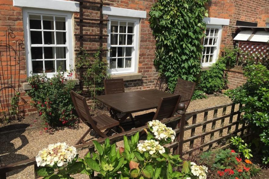 A beautiful cottage set in the grounds of Hunmanby Hall, Hunmanby, near Filey.
