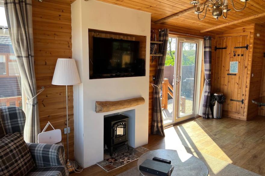 Enjoy Stag's Head, a luxury log cabin style lodge