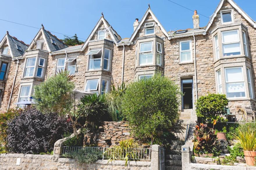 Treloweth, a large family home with sea views, parking and outside space, free WifI.