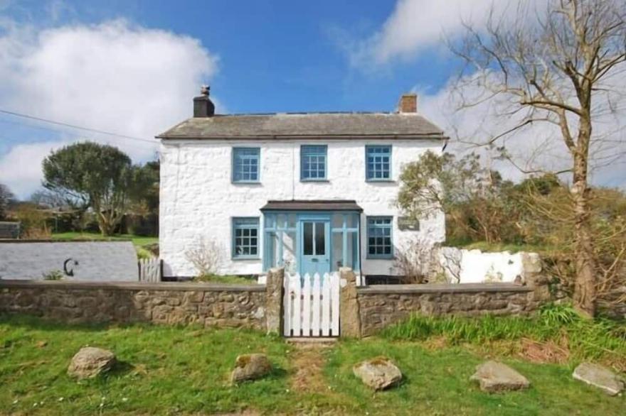 Pretty Georgian farmhouse in peaceful village location near the sea.